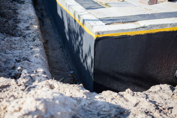 Professional Interior Drainage System technician working in Greenlawn, NY